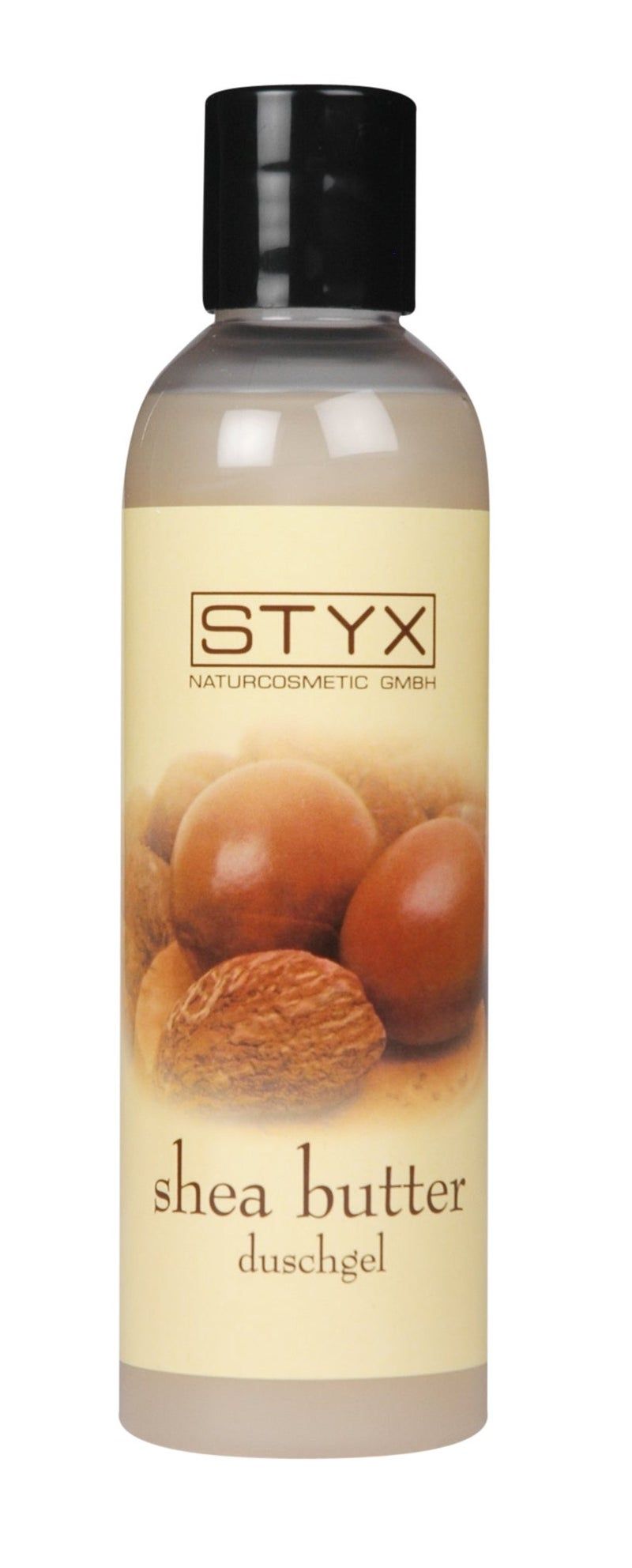 Eine Flasche STYX Shea Butter Duschgel. Auf dem Etikett sind Sheanüsse abgebildet. Schwarzer Deckel.