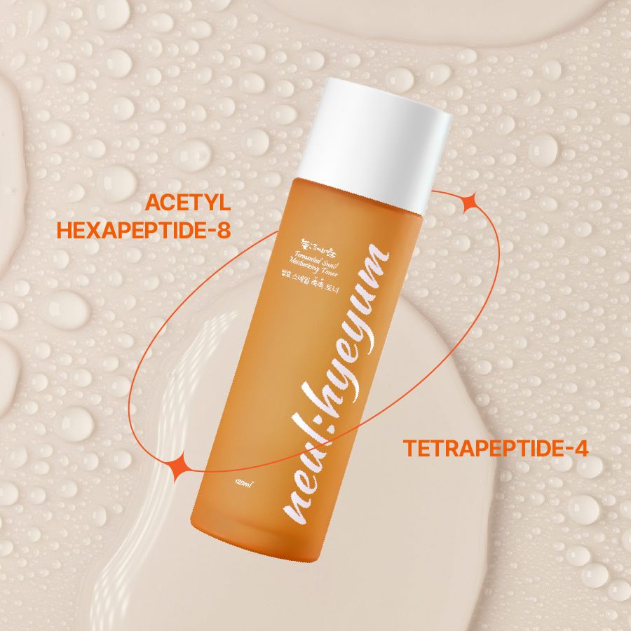 Orangefarbene Flasche mit weißem Deckel. Aufschrift "neul:hyeyum" in weißer Schrift. Text mit Pfeilen.