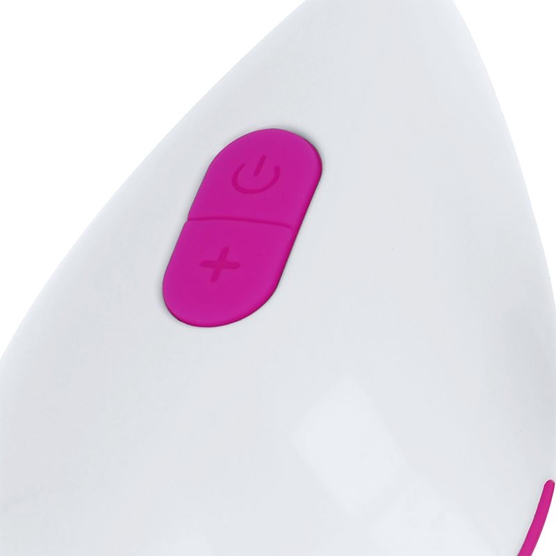 Nahaufnahme eines weißen Geräts mit pinken Knöpfen. Pinke Knöpfe mit Plus- und Ein/Aus-Symbolen.