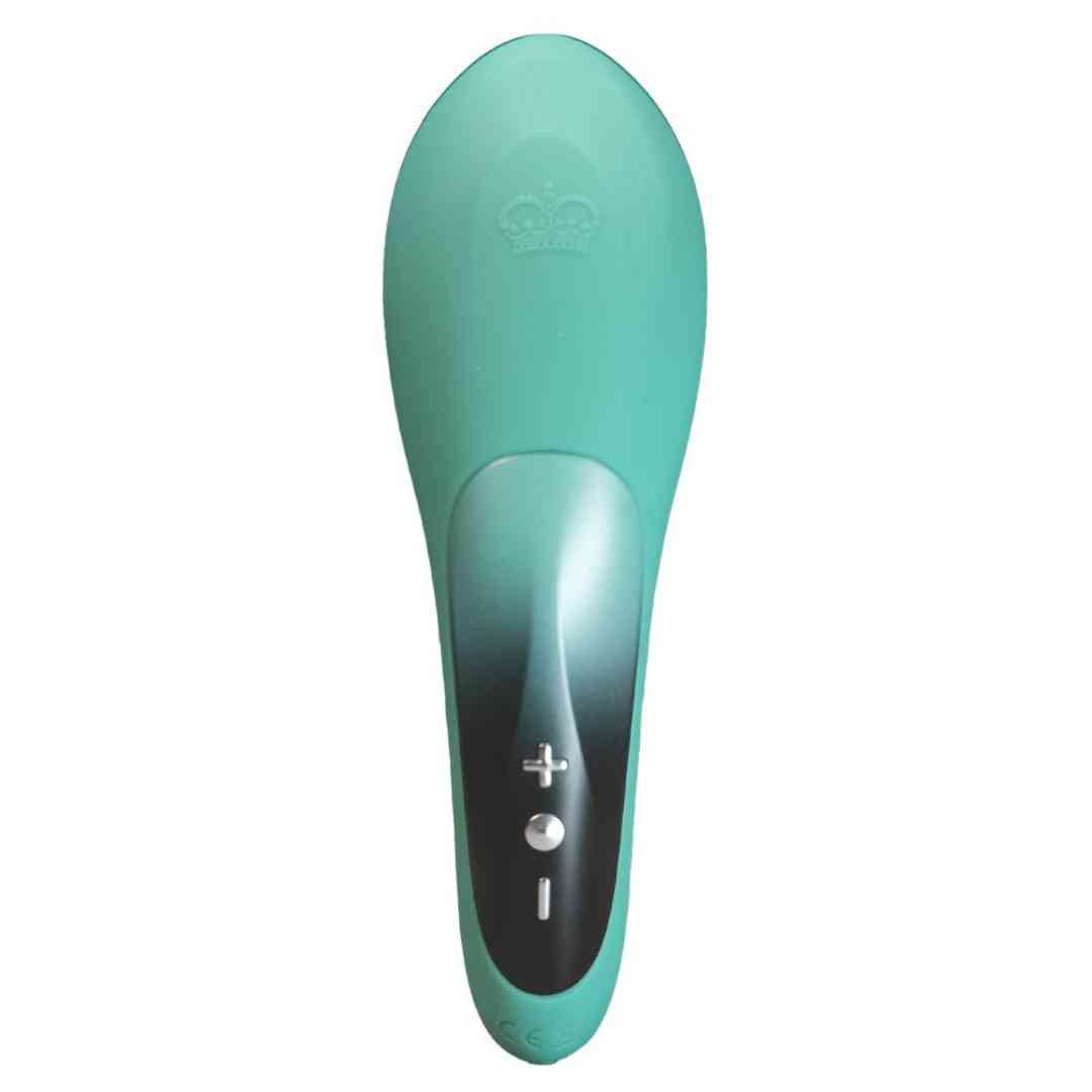 Türkisfarbener Vibrator. Oberseite mit Krone. Bedienfeld mit Plus- und Minuszeichen. Schwarzer Akzent.
