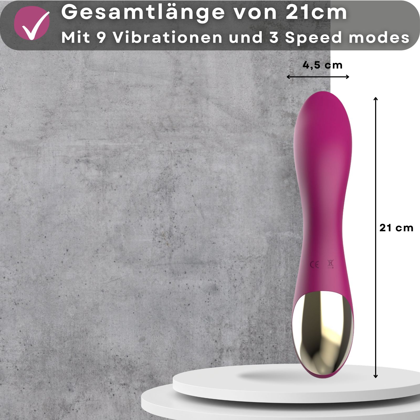 Lila Vibrator. Länge 21 cm, Durchmesser 4,5 cm. Auf weißer Plattform. Goldfarbener Akzent. Drei Knöpfe. Form: Tropfen.