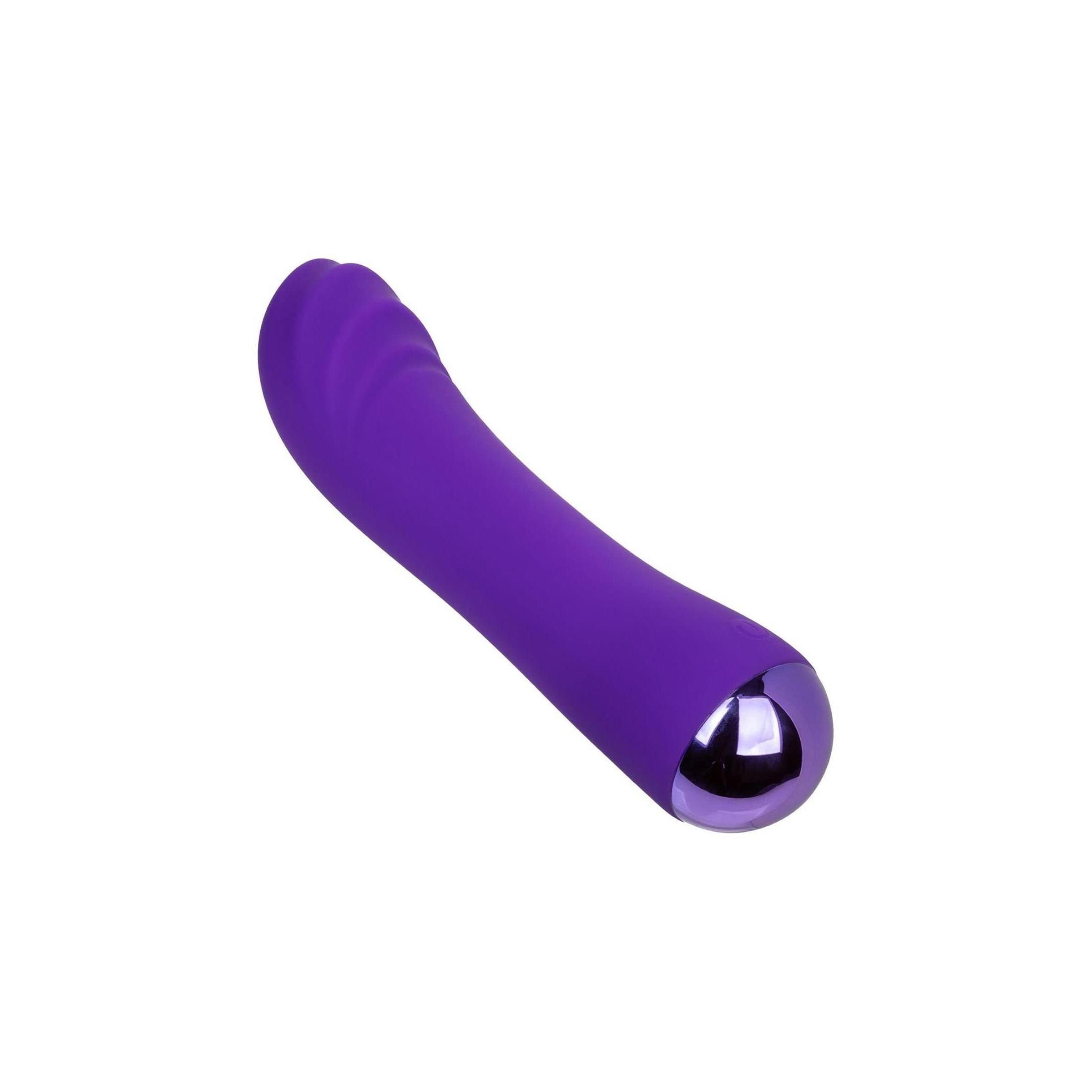 Lila Vibrator mit geriffelter Oberfläche. Gebogene Form mit abgerundeter Spitze und Basis.