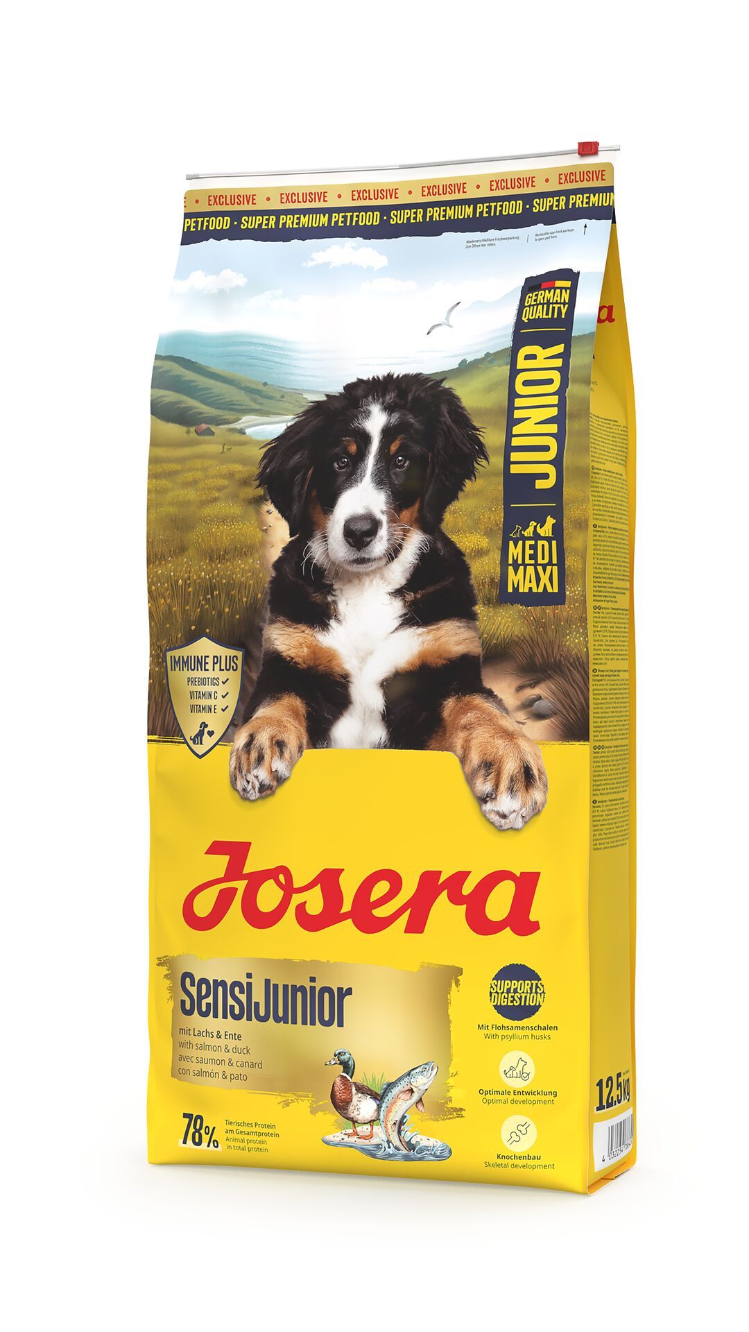 Gelber Beutel JOSERA Junior SensiJunior. Ein Welpe schaut aus dem Beutel. Text: Medi Maxi, 12,5 kg, Lachs & Ente, 78% tierische Proteine.