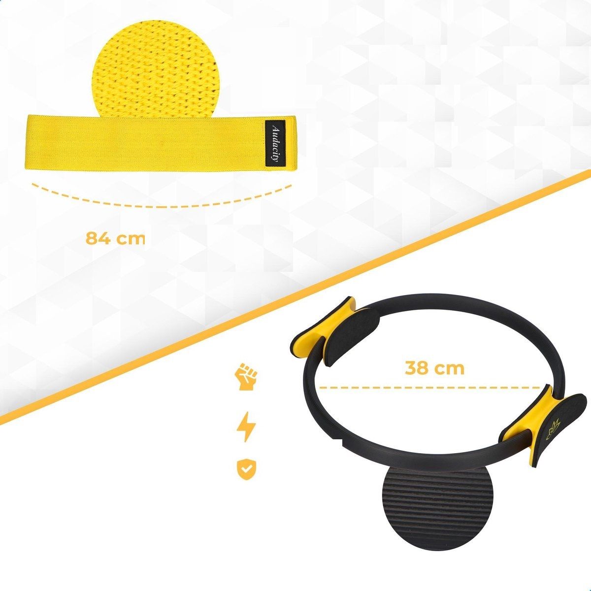 Gelbes Widerstandsband und Pilates-Ring. Band: 84 cm. Ring: 38 cm. Gelbe Details. Schwarzer Ring mit gelben Griffen.