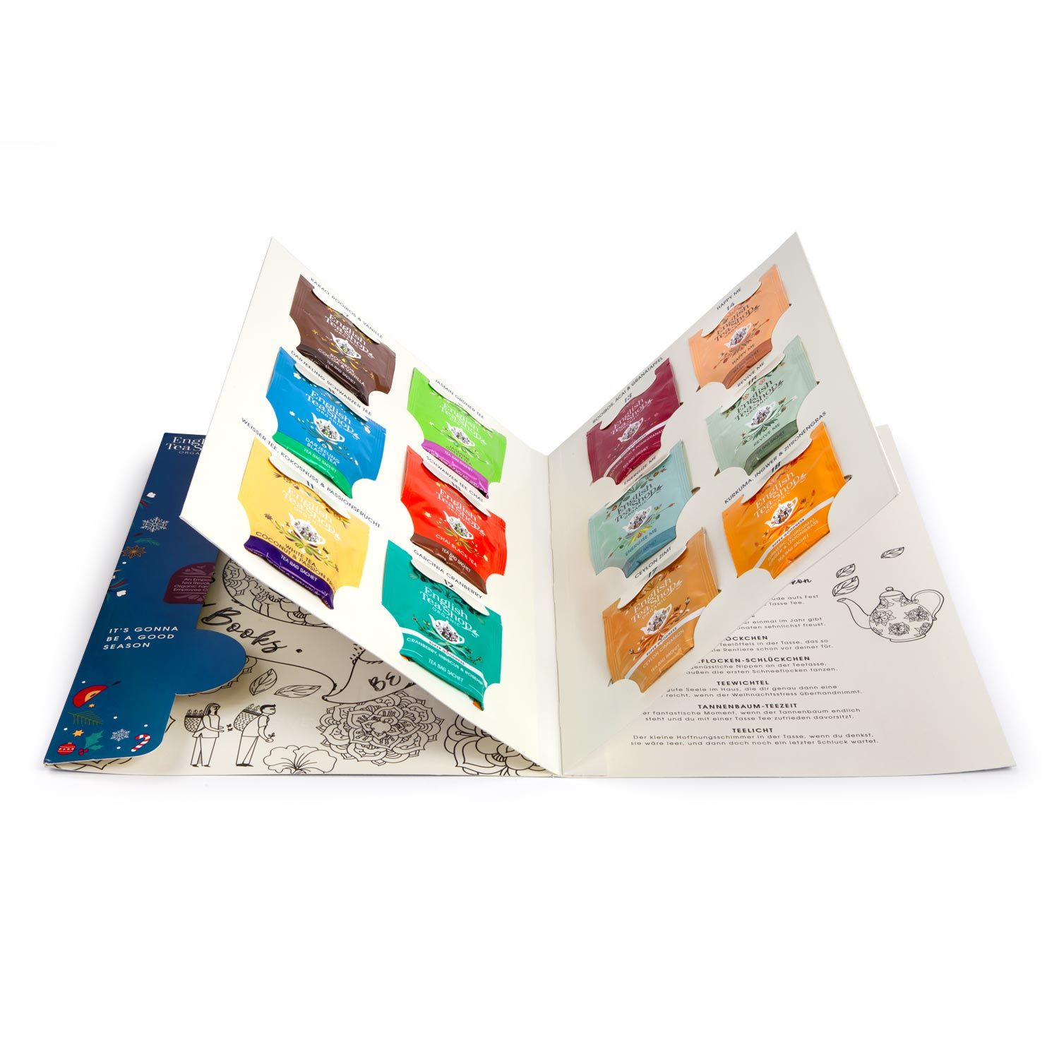 Geöffneter Adventskalender mit 24 Teebeuteln in verschiedenen Farben. Illustrationen auf den Innenseiten. Blick von oben.