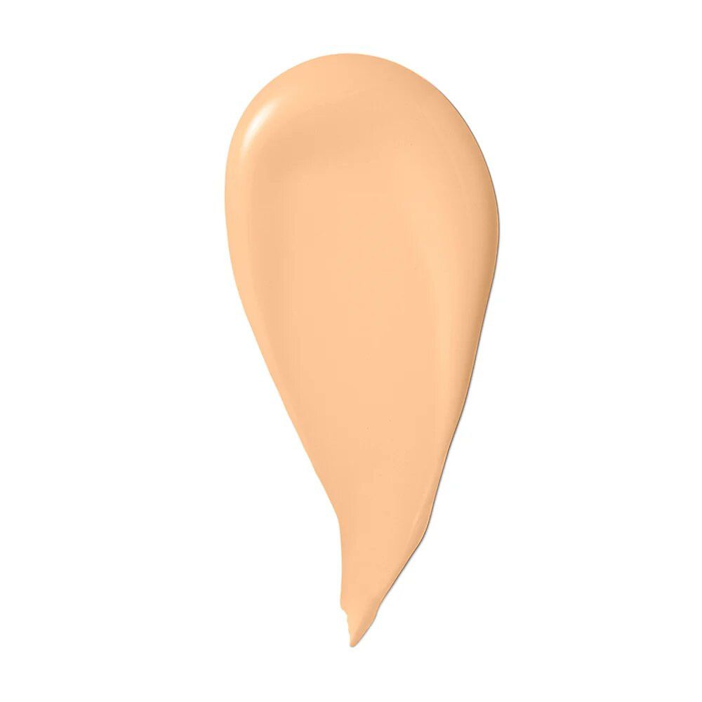 Heller, cremefarbener Make-up-Tropfen auf weißem Hintergrund. Form erinnert an einen Tropfen.