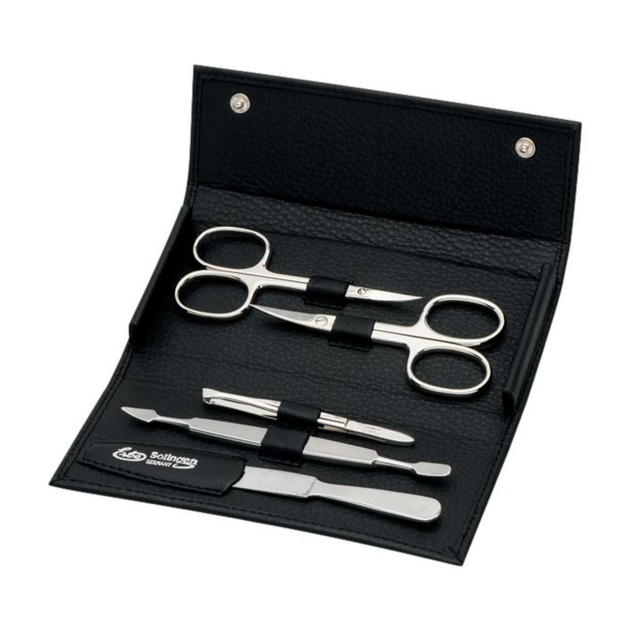 Schwarzes Etui mit Maniküre-Set. Enthält Schere, Nagelfeile und weitere Werkzeuge. Marke: Solingen.