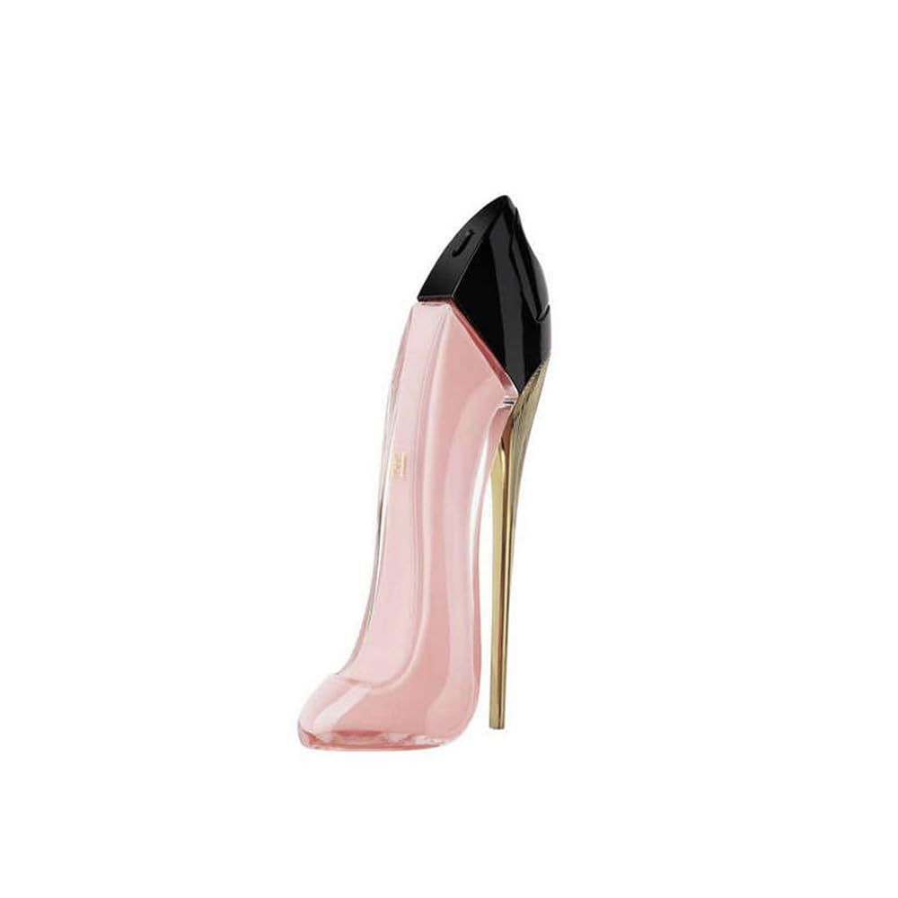 Rosa High Heel Flakon mit schwarzem Verschluss und goldfarbenem Absatz. Steht aufrecht.