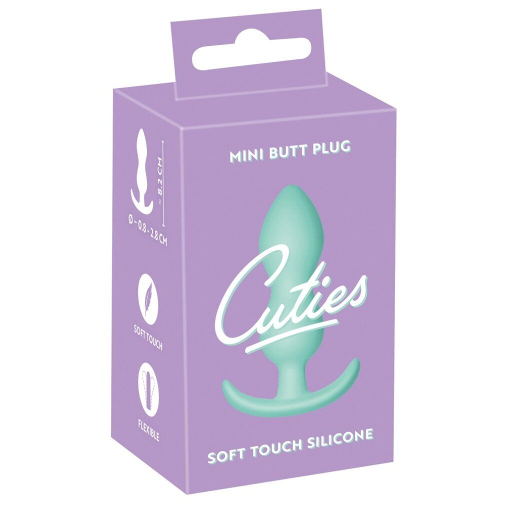 Verpackung für einen Mini-Buttplug. Aufschrift: Cuties, Soft Touch Silicone. Produkt in der Verpackung abgebildet.