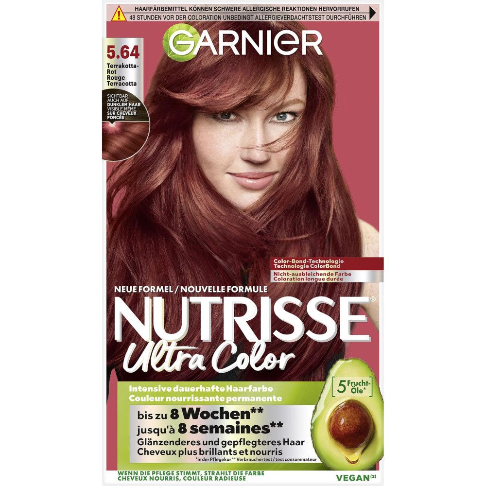 Garnier Nutrisse Ultra Color. Haarfarben-Verpackung mit Frau, die Haarfarbe 5.64 trägt. Avocado-Symbol. Vegan-Siegel.