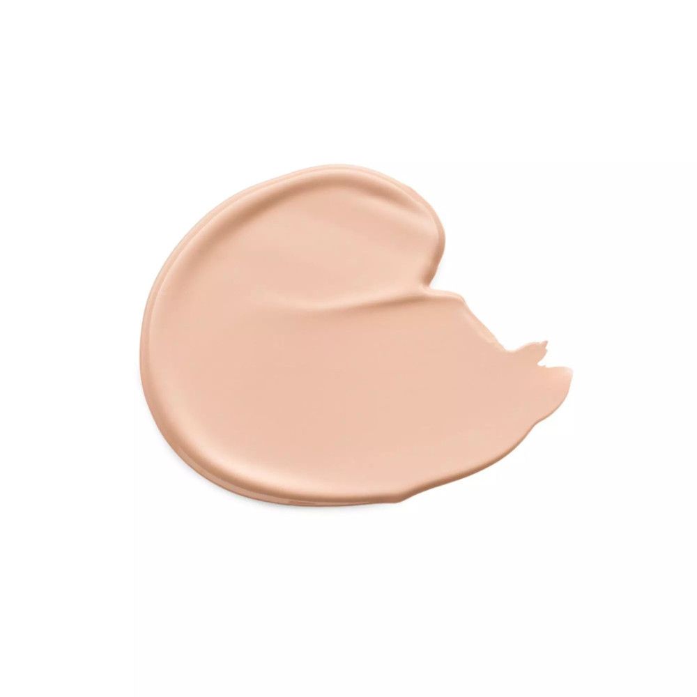 Klecks Flüssig-Concealer. Beige Farbe auf weißem Hintergrund. Glatte Textur. Produktname nicht sichtbar.