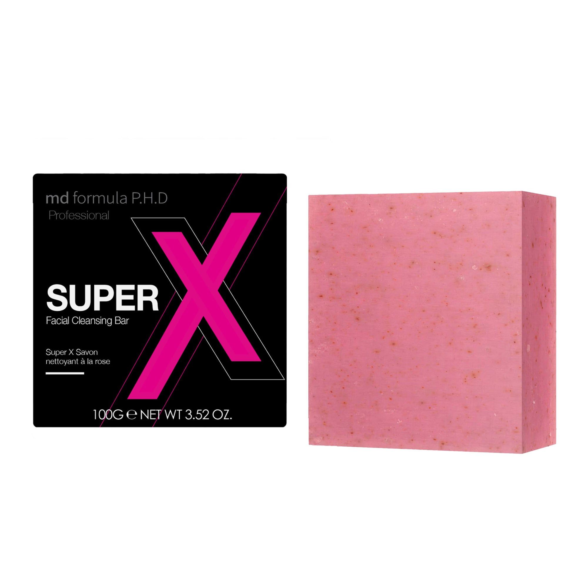 Rosa Gesichtsreinigungsseife und Verpackung. Verpackung mit "SUPER X" und Produktinformationen. Seife in Würfelform.