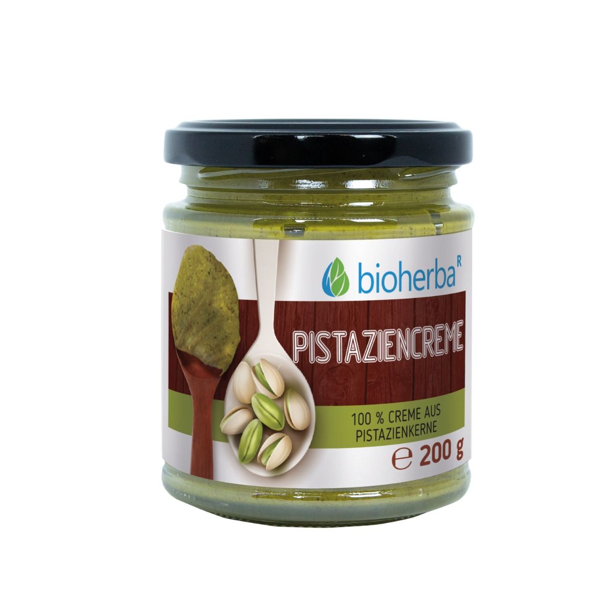 Glas mit Pistaziencreme. Schwarzer Deckel. Etikett mit Produktname und Logo. 100% Creme aus Pistazienkernen. 200 g.