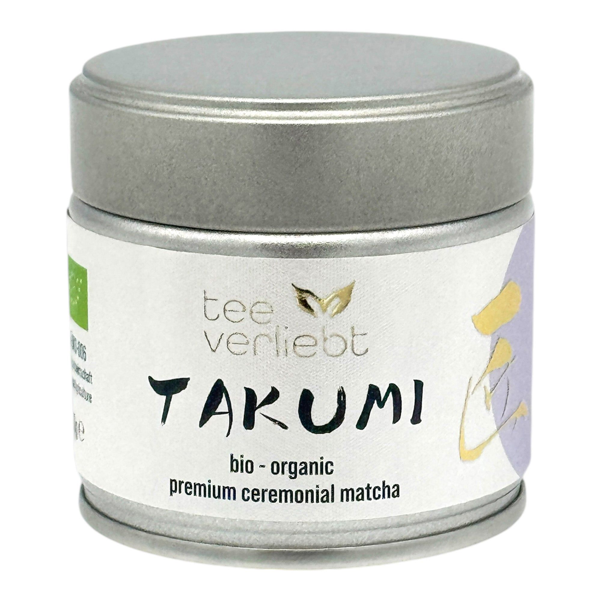 Runde Dose mit Deckel. Aufschrift: teeverliebt, TAKUMI, bio-organic, premium ceremonial matcha. Bio-Siegel.