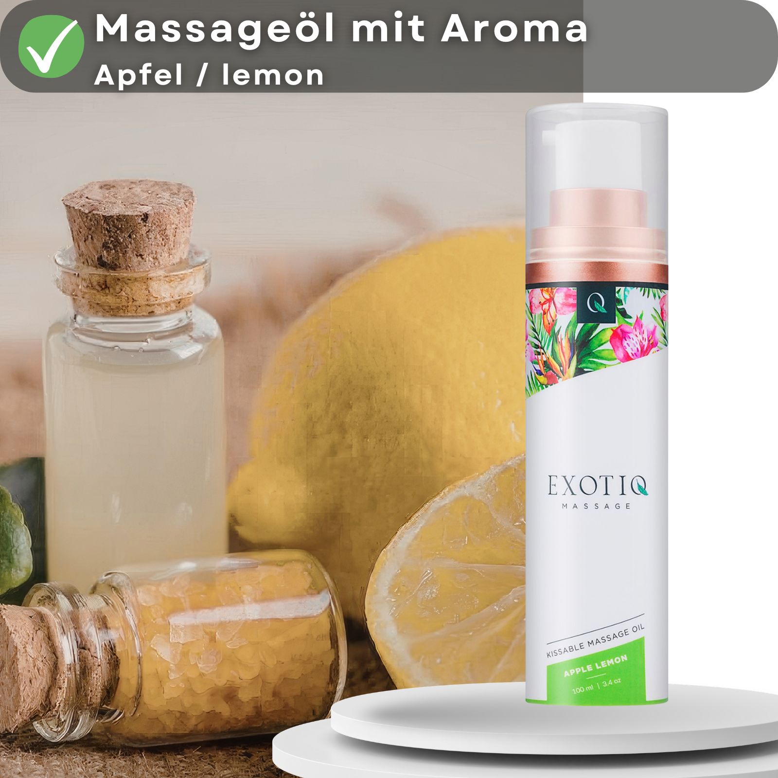 Produktpräsentation mit Massageöl-Flasche, Zitrone und Fläschchen. Text: Massageöl mit Aroma Apfel/Zitrone.