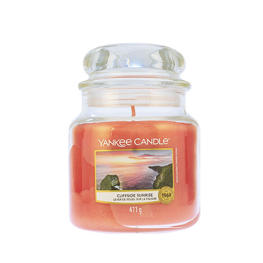 Yankee Candle, Glasbehälter mit Deckel. Orangeroter Wachs, Etikett mit Landschaftsmotiv und Produktbezeichnung. Gewicht: 411 g.