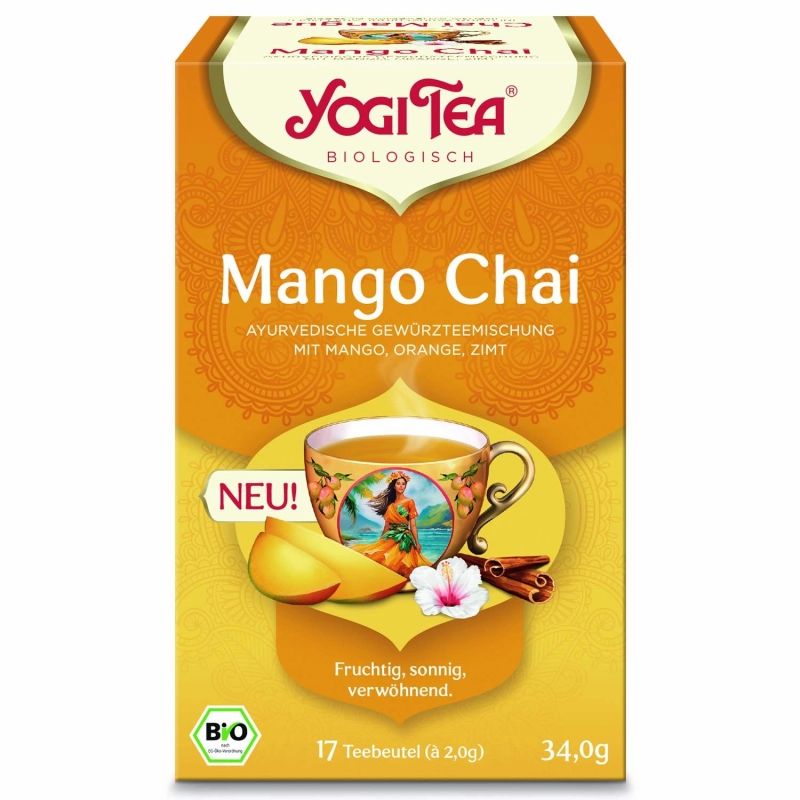 Verpackung von Mango Chai Tee. Gelbe Schachtel mit Logo und Produktbezeichnung. Abbildung einer Tasse Tee, Mango, Zimtstange und Blüte.
