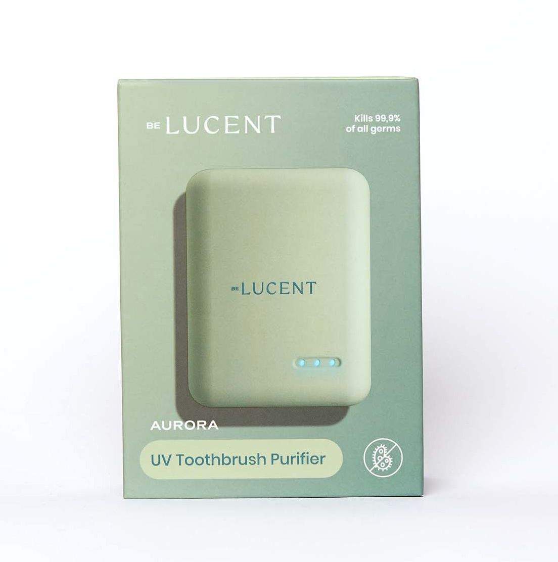 Verpackung mit Etui. Aufschrift "BE LUCENT AURORA UV Toothbrush Purifier". Tötet 99,9% der Keime.