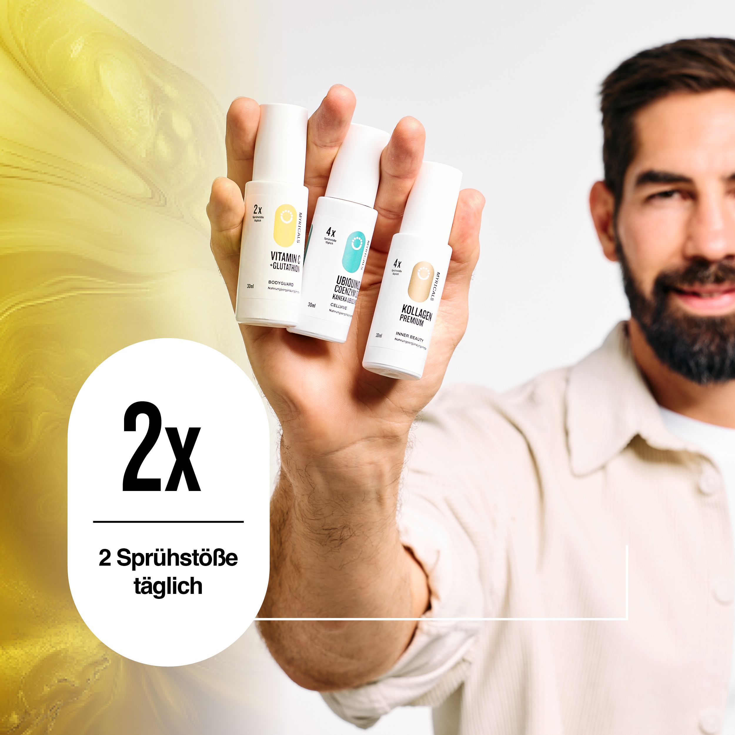 Drei Sprühflaschen in einer Hand. Aufschrift: VITAMIN C + GLUTATHION. Text: 2 Sprühstöße täglich.