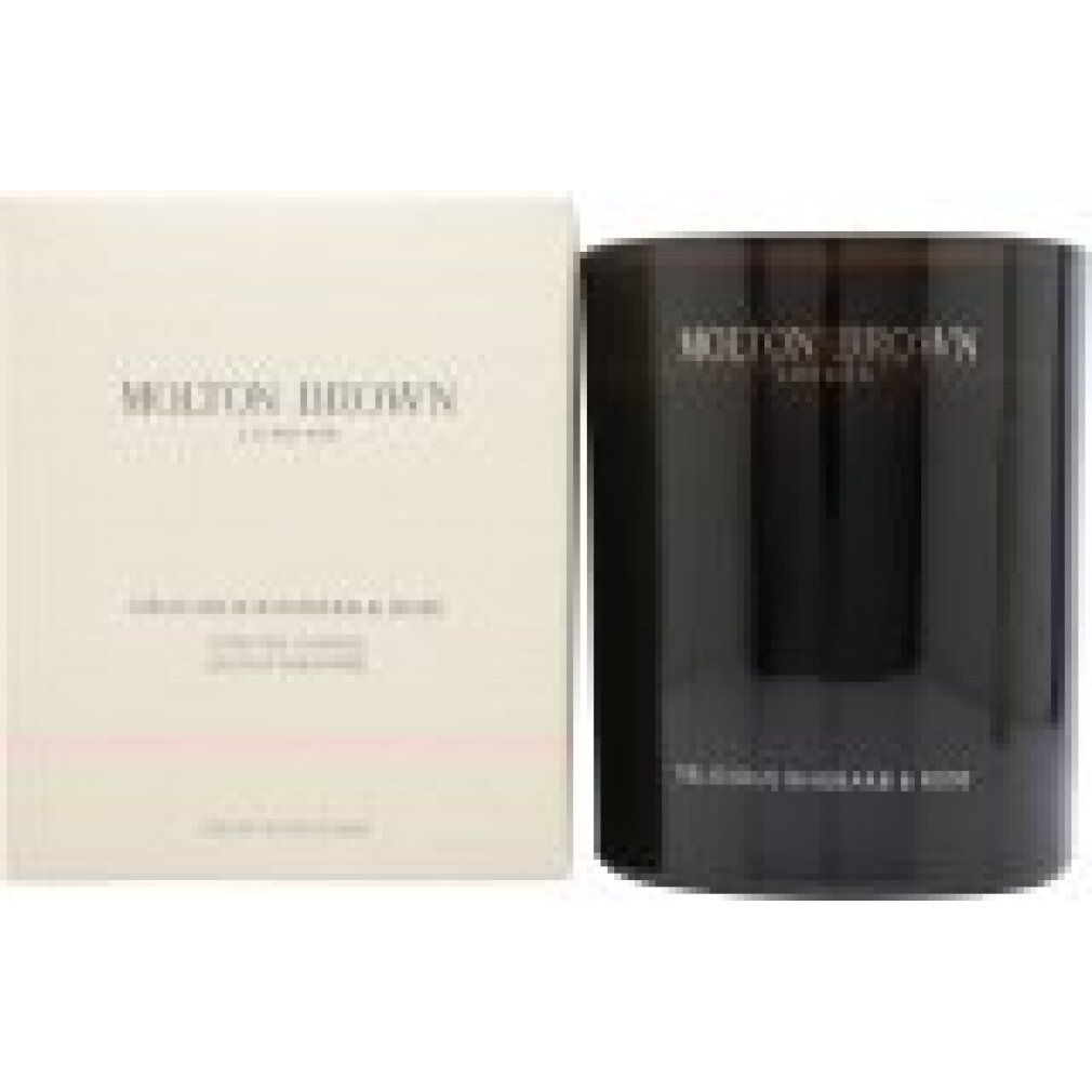 Braune Molton Brown Duftkerze 'Delicious Rhubarb & Rose' in dunkler Glasverpackung.