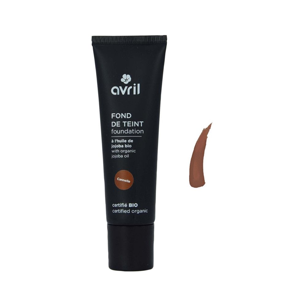 Schwarze Tube Avril Foundation, Cannelle-Farbton. Text: Fond de Teint, à l'huile de jojoba bio, certifié BIO. Farbprobe daneben.