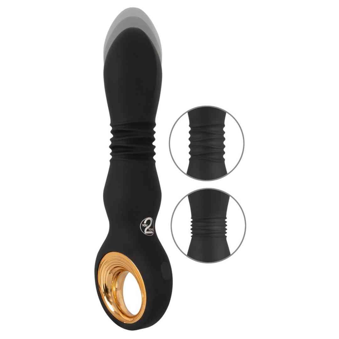 Schwarzer Vibrator mit goldfarbenem Ring. Geriffelte Mitte, ovale Form, Kreis mit Zahl 2.