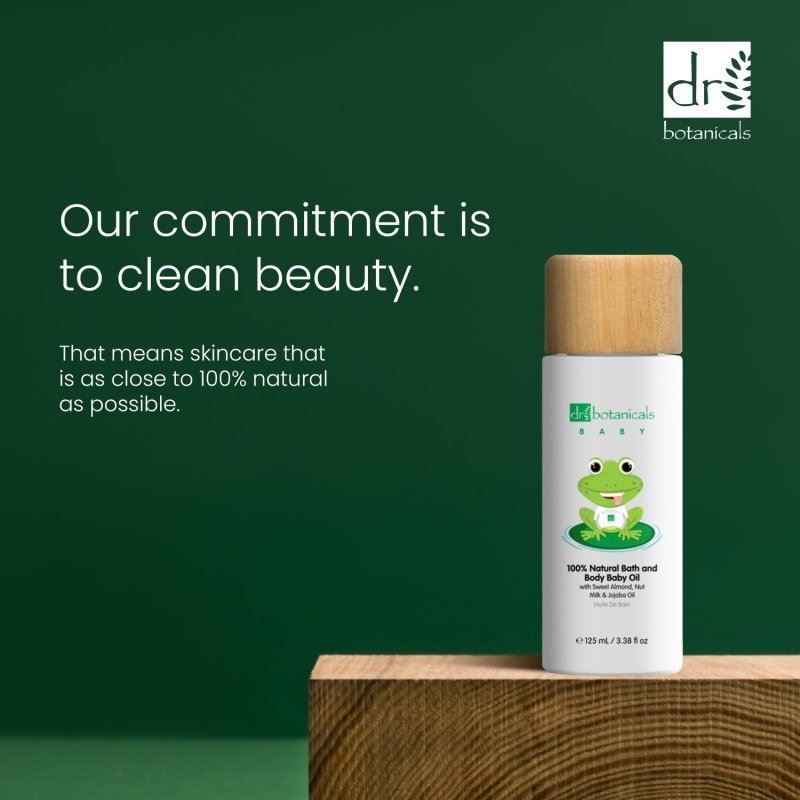 Dr. Botanicals Babyöl Flasche mit Text über saubere Schönheit und natürliche Inhaltsstoffe.
