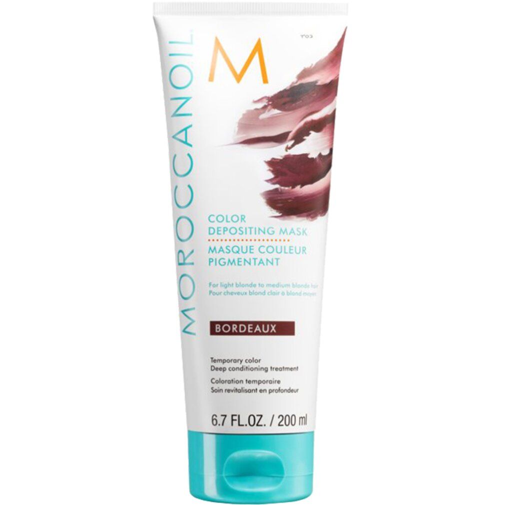 Moroccanoil Color Depositing Mask Bordeaux. Weiße Tube mit bordeauxfarbenem Farbverlauf. Türkisgrüner Deckel. Text: Color Depositing Mask.